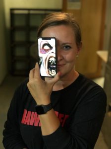 a person holding a camera in front of a mirror posing for the camera